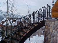 iron-anvil-railing-scrolls-and-patterns-panels-castings-circular-stair-park-city-3