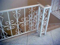 iron-anvil-railing-scrolls-and-patterns-repeating-steel-patterns-white-railing-by-others-1-1