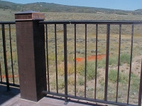 iron-anvil-railing-single-top-simple-yukon-railing-single-top-glenwild-deck-with-hammered-bar-1
