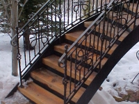 41-0040-iron-anvil-stairs-grand-circular-treads-angle-iron-wood-steps-park-city-3