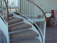41-0050-iron-anvil-stairs-grand-circular-treads-angle-iron-wood-treads-jensen-wally-stair-saratoga-springs-2