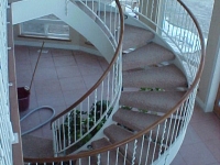 41-0050-iron-anvil-stairs-grand-circular-treads-angle-iron-wood-treads-jensen-wally-stair-saratoga-springs