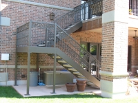 iron-anvil-stairs-double-stringer-treads-concrete-diamond-pattern-gustaferson-2