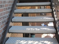 iron-anvil-stairs-double-stringer-treads-concrete-diamond-pattern-gustaferson-7