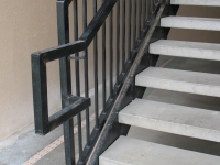 iron-anvil-stairs-double-stringer-treads-concrete-smooth-1