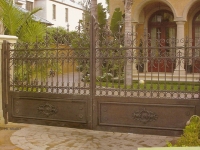 iron-anvil-gates-by-others-driveway-scroll-scanned-photo