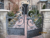 iron-anvil-gates-by-others-man-scroll-doors-provo-subdivision