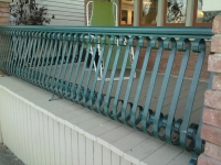 iron-anvil-railing-belly-rail-single-top-flat-bar-s-scroll-fontaine-532-n-center-st-by-others