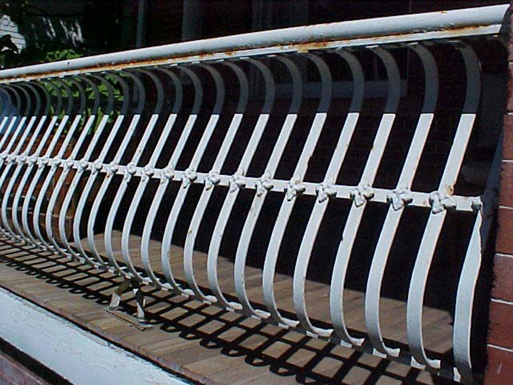 iron-anvil-railing-by-others-belly-rail-flowers-dorrell-on-2nd-ave