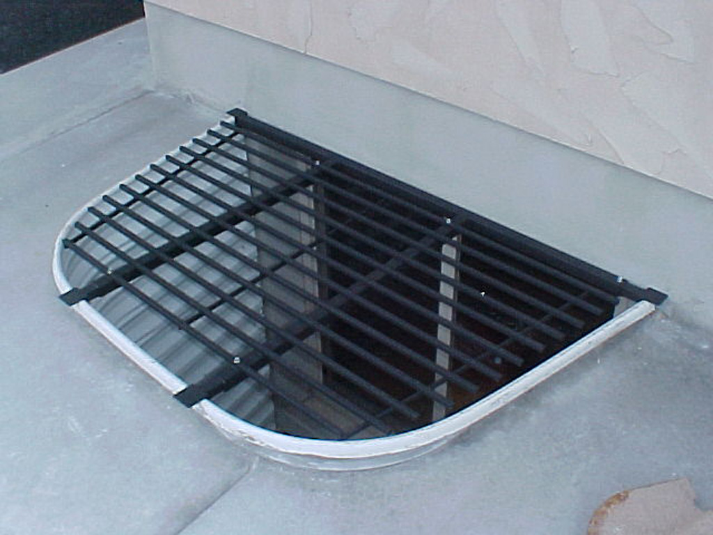 iron-anvil-security-grates-adjustable-cement-1