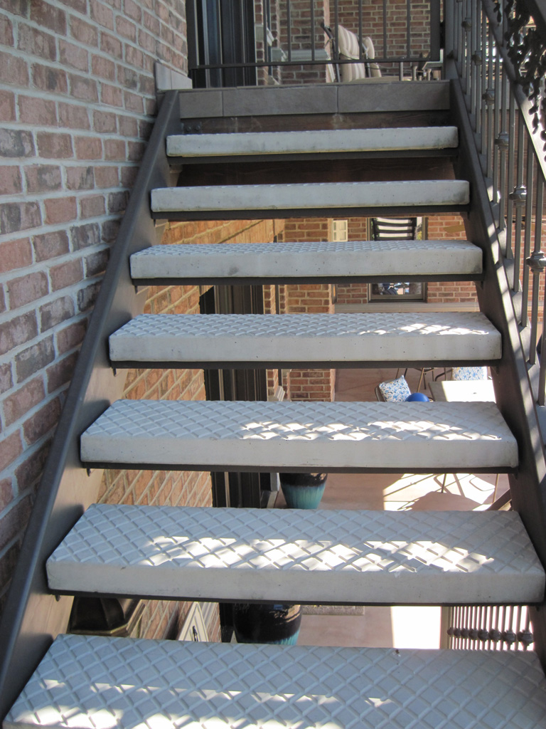 iron-anvil-stairs-double-stringer-treads-concrete-diamond-pattern-gustaferson-7