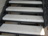 iron-anvil-stairs-double-stringer-treads-concrete-smooth-by-others2